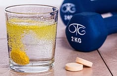weights and tablet in water