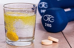 weights and tablet in water